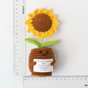 Detail showing height and width of a handmade crochet sunflower plant with scale rulers