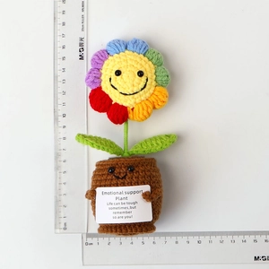 Detailed view of handmade crochet colorful sunflower pot with motivational card and scale
