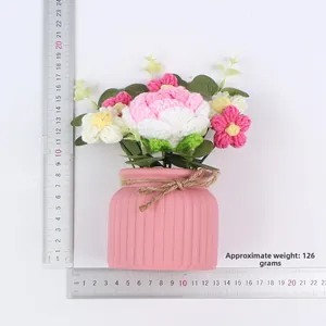 Handmade crochet flower pot in pink stripes measuring approx 18cm with 126g weight