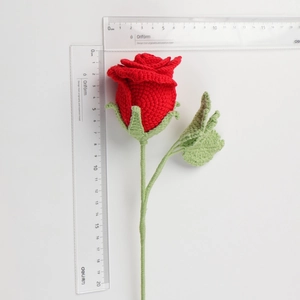 Detail of handmade crochet red rose bouquet showing texture and size measurement