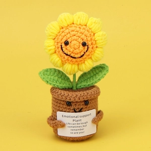 Detail of crochet sunflower pot with cute smiling face and motivational card