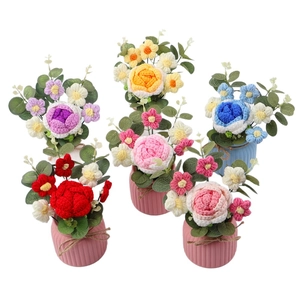 Handmade crochet rose flower potted plant arrangement with colorful wool petals