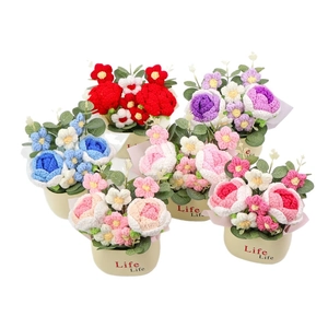 Handmade crochet rose flower pots in various colors for desktop decoration