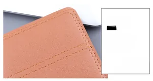 Macro shot of brown pebble grain leather with precise double reinforced stitching detail