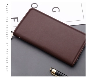 Close-up of dark coffee litchi grain leather men's clutch with silver metal zipper