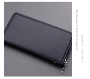 Detail of premium black leather men's clutch featuring a smooth silver metal zipper track