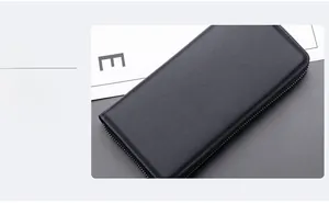 Detail of black large capacity men's business clutch bag with lychee grain texture