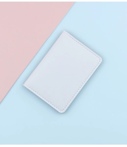 Detailed view of minimalist white slim card holder made from fine textured PU leather