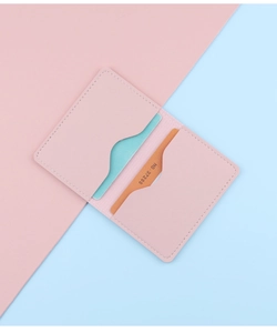 Detail of pink slim leather card holder with dual slots and elegant stitching