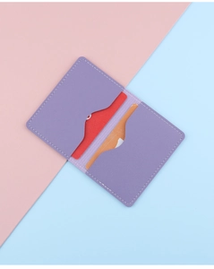 Detail view of slim purple leather card holder featuring dual curved internal card slots