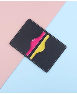 Detail view of black leather card holder with contrast stitching and card slots