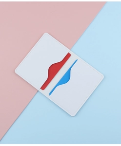 Close-up of a white minimalist card holder with two slots and high-quality stitching