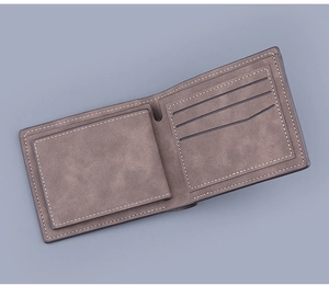 Detailed interior of brown bifold wallet showing coin pocket and credit card slots