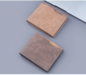 Detail of short bifold men's wallets in light brown and dark grey matte faux leather