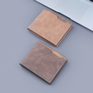 Slim men's bifold matte leather wallets in tan and dark grey colors with topstitch details