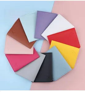 Macro shot of colorful PU leather passport covers featuring embossed airplane patterns