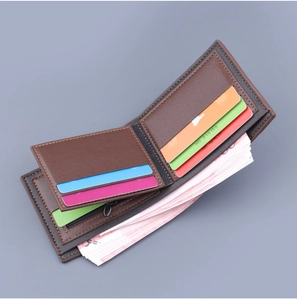 Detail view of brown leather wallet interior with multiple card slots and coin pocket