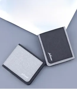 Flat lay of men's canvas short wallets in light grey and dark black colors
