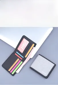 Detail view of the multi-slot interior in a bifold canvas wallet with RFID protection