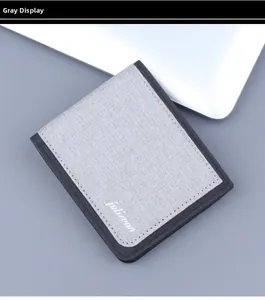 Detailed close-up of grey linen texture canvas wallet with black stitching and logo