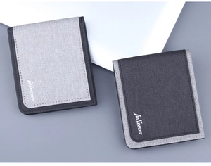 Close-up of minimalist bi-fold canvas wallets in light and dark grey with stitching