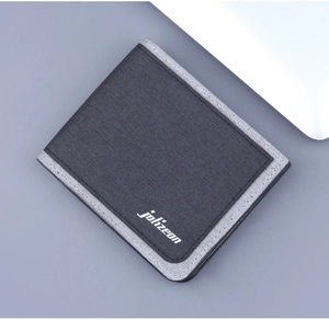 Diagonal close-up of a dark grey canvas bifold wallet with white brand logo detail