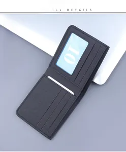 Detailed view of dark grey canvas wallet featuring multiple card slots and clear ID window
