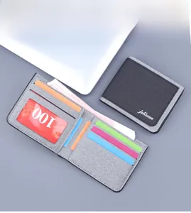 Detailed interior of grey canvas wallet showing multiple card slots and clear ID window