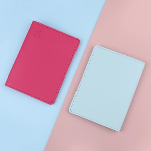 Travel passport holder set in rose red and light blue PU leather with airplane logo