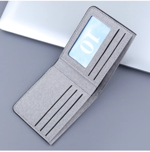 Detail view of grey canvas bifold wallet interior showing 6 card slots and 1 ID window