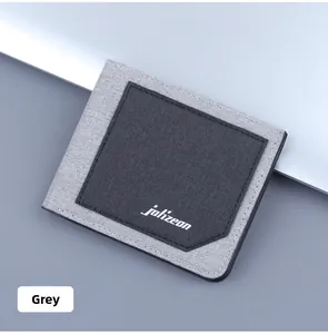 Detail of slim bifold men's canvas wallet with gray patchwork design and fine stitching