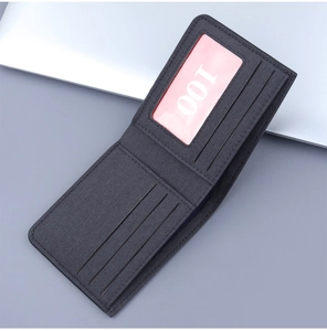 Detailed view of grey canvas wallet interior with three card slots and one ID window