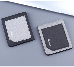Detail view of ultra-slim canvas card holders in grey color blocks and diagonal card slots