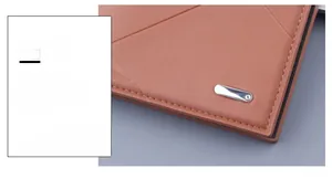 Close-up of brown lychee grain leather wallet with silver metal hardware and stitching