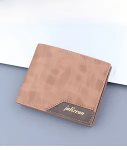 Close-up of brown textured men's bi-fold wallet with elegant stitched logo detail