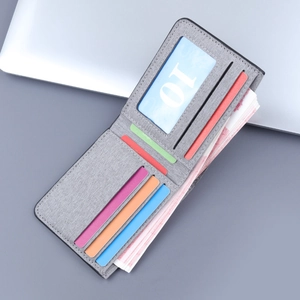 Slim grey canvas bifold wallet with five colorful card slots and ID window