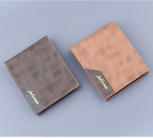 Macro detail of men's short leather wallets showing cross-hatch texture and logo