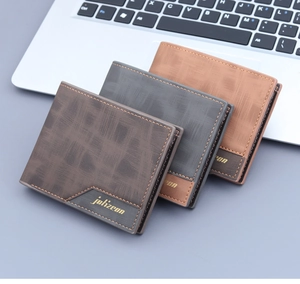 Detailed view of men's bifold wallets with brushed texture and metal logo plaque