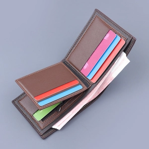 Brown leather bifold wallet with multiple card slots and a zippered coin pocket