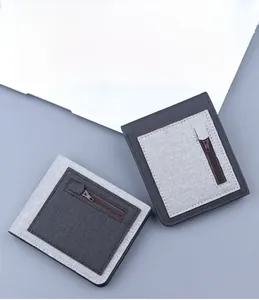 Detailed view of ultra-thin canvas wallets with contrasting grey tones and side zipper pocket