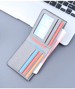 Detailed view of grey canvas wallet interior with colorful card slots and cash compartment