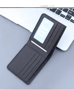 Detailed view of dark grey canvas wallet featuring multiple card slots and an ID window
