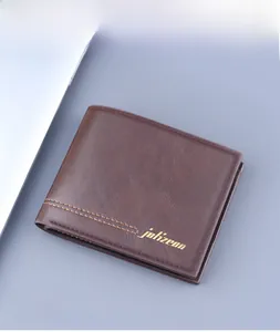 Detailed view of a brown bifold men's wallet with orange stitching and gold logo