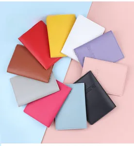 Close-up of vibrant candy-colored PU leather passport covers with embossed passport lettering