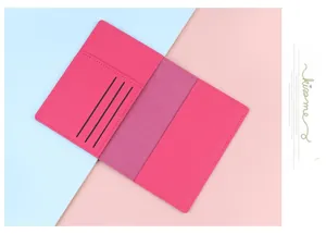 Detailed interior of a pink leather passport holder with three card slots and smooth stitching