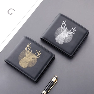 Slim black leather bifold wallet for men featuring gold and silver deer head emblems