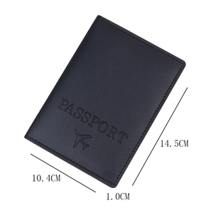 Minimalist black faux leather passport holder with embossed logo and size dimensions