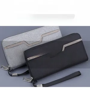 Detailed close-up of canvas men's long wallet with zip and V-shaped grid texture