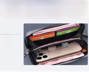 Detailed interior of long canvas wallet showing card slots and large phone compartment