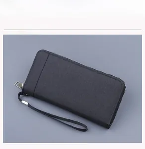 Detail of black canvas wallet featuring a durable silver zipper and detachable wrist strap